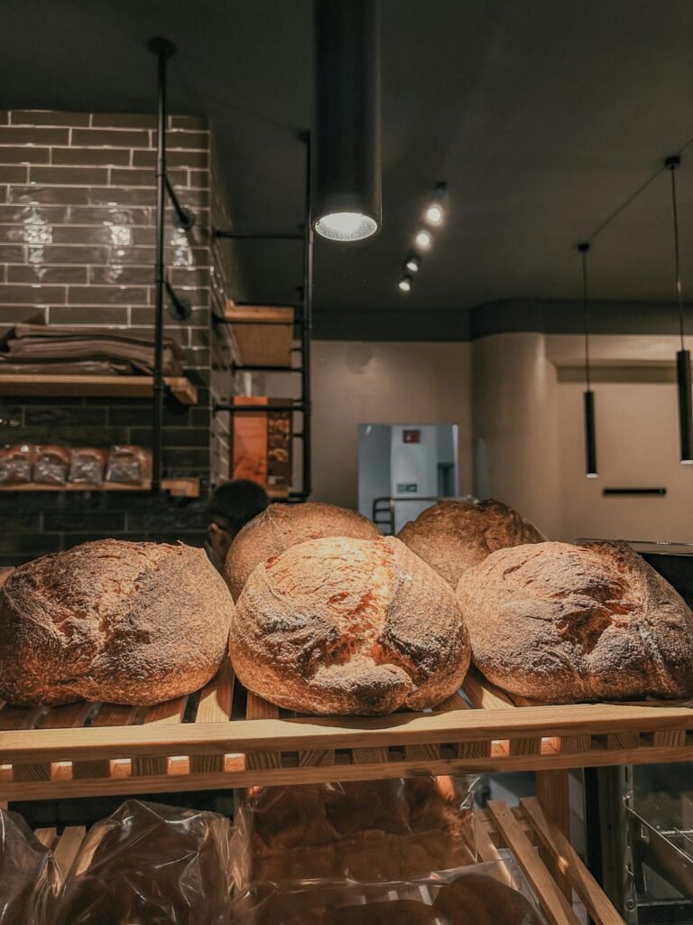 Warm and rustic scene of freshly baked artisan bread in a cozy bakery. Perfect for bread lovers.